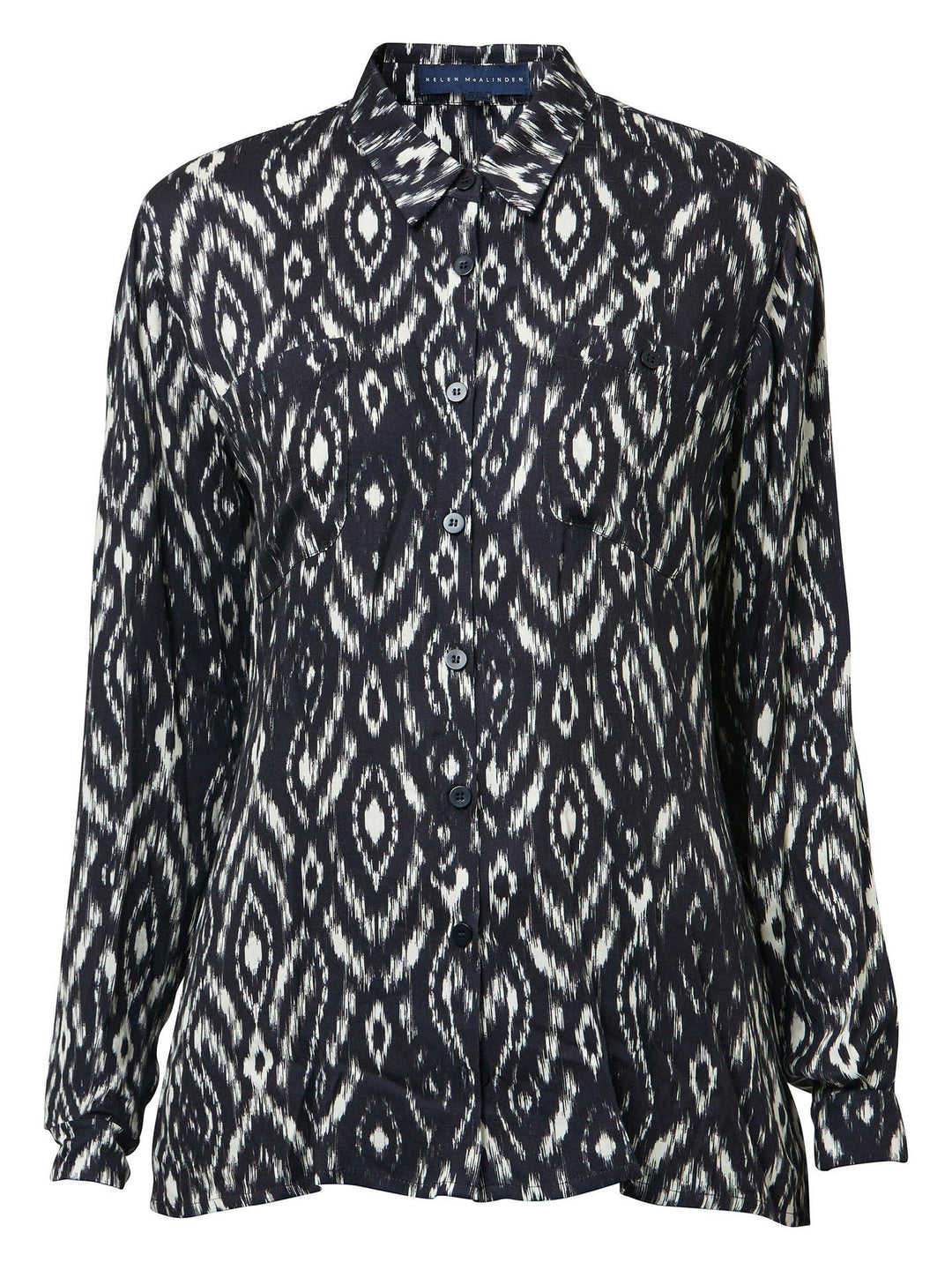 Ella, a classic utilitarian shirt crafted in a fluid black and cream ikat printed viscose. This must-have shirt features patch pockets, back yoke & center back box pleat. an easy-fit shirt to elevate your everyday. Helen's tip - style with the jill black pant for a sense of put-together ease.