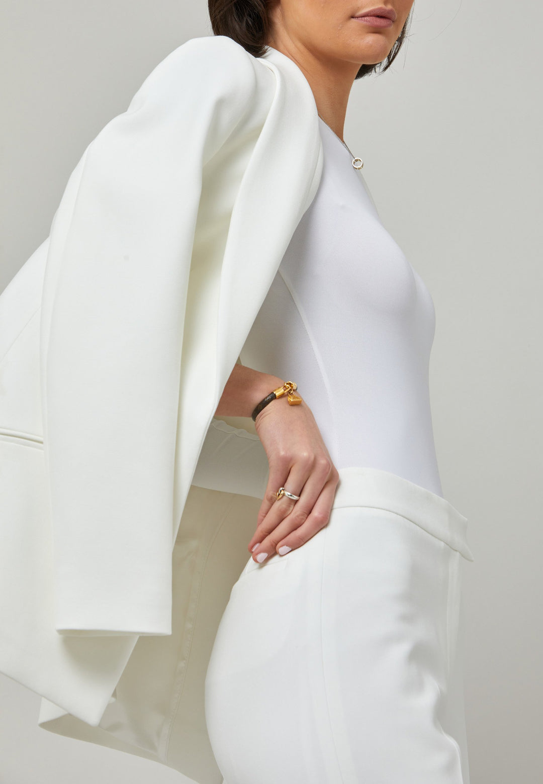 Darcie, a minimalist wardrobe must-have. This investment-worthy tailored tux jacket is engineered with a classic shawl collar and simple jeet pockets. Cut to a semi fitted silhouette with a single button closure. Fabricated in our signature double crepe with a hint of stretch in iconic white. The perfect balance between classic & elegance. Pair with a simple tee or elevate the look with the co-ordinating jill pant.