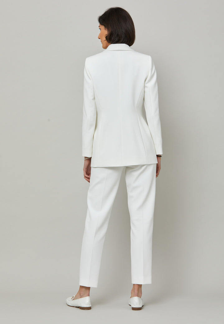 Darcie, a minimalist wardrobe must-have. This investment-worthy tailored tux jacket is engineered with a classic shawl collar and simple jeet pockets. Cut to a semi fitted silhouette with a single button closure. Fabricated in our signature double crepe with a hint of stretch in iconic white. The perfect balance between classic & elegance. Pair with a simple tee or elevate the look with the co-ordinating jill pant.