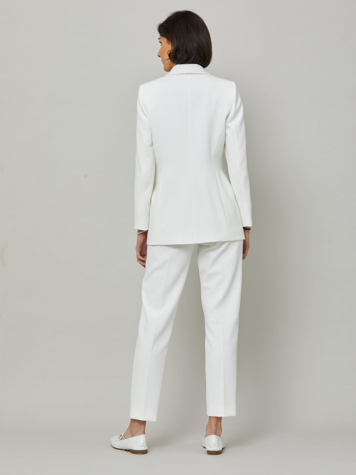 Meet Darcie, a minimalist wardrobe must-have. This piece will elevate your wardrobe. Style with matching slim leg or bootleg pants for chic and tailored look. Fabricated in our signature double crepe with a hint of stretch in iconic white. The perfect balance between classic & elegance.
