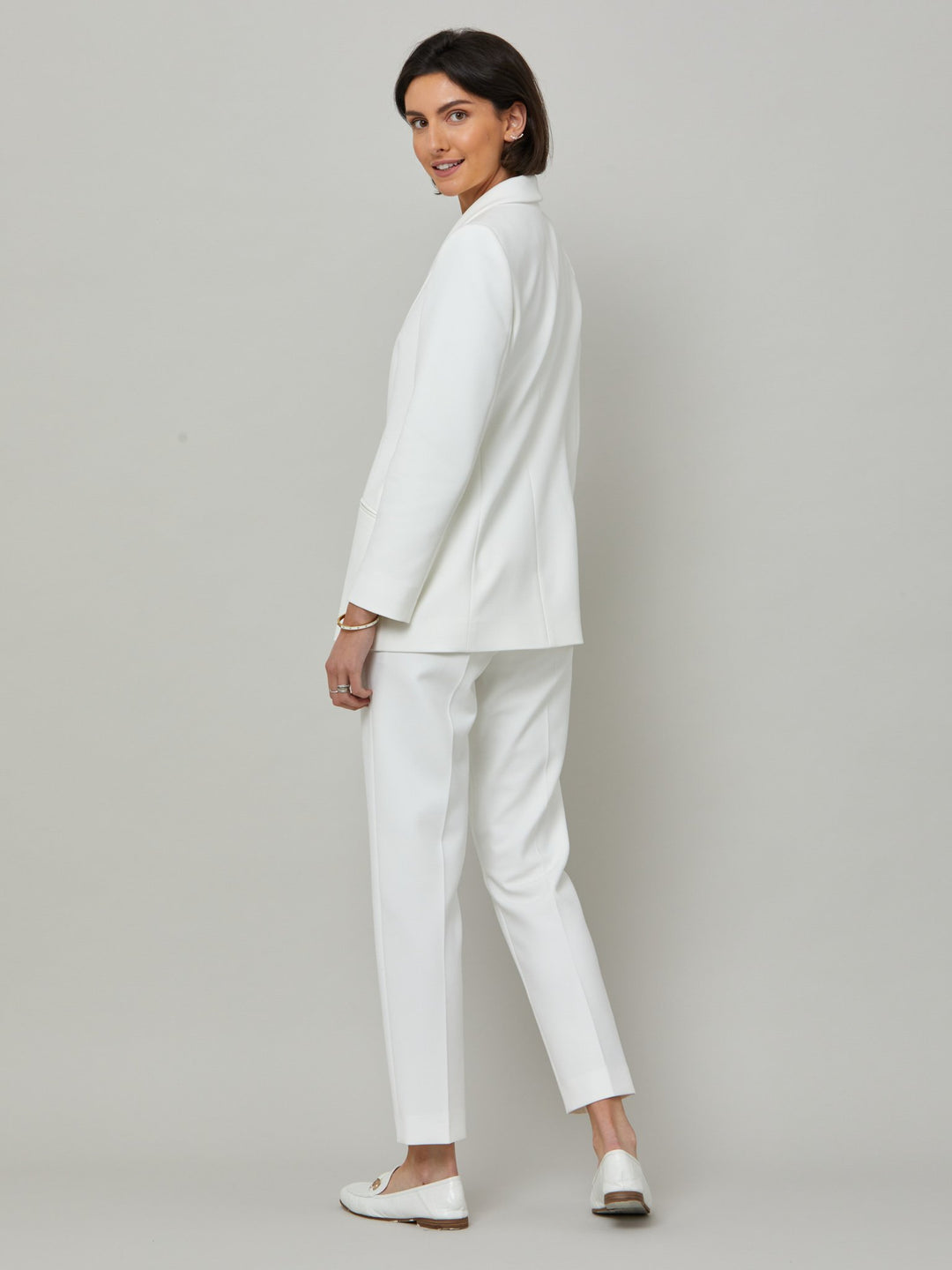 Meet Darcie, a minimalist wardrobe must-have. This piece will elevate your wardrobe. Style with matching slim leg or bootleg pants for chic and tailored look. Fabricated in our signature double crepe with a hint of stretch in iconic white. The perfect balance between classic & elegance.