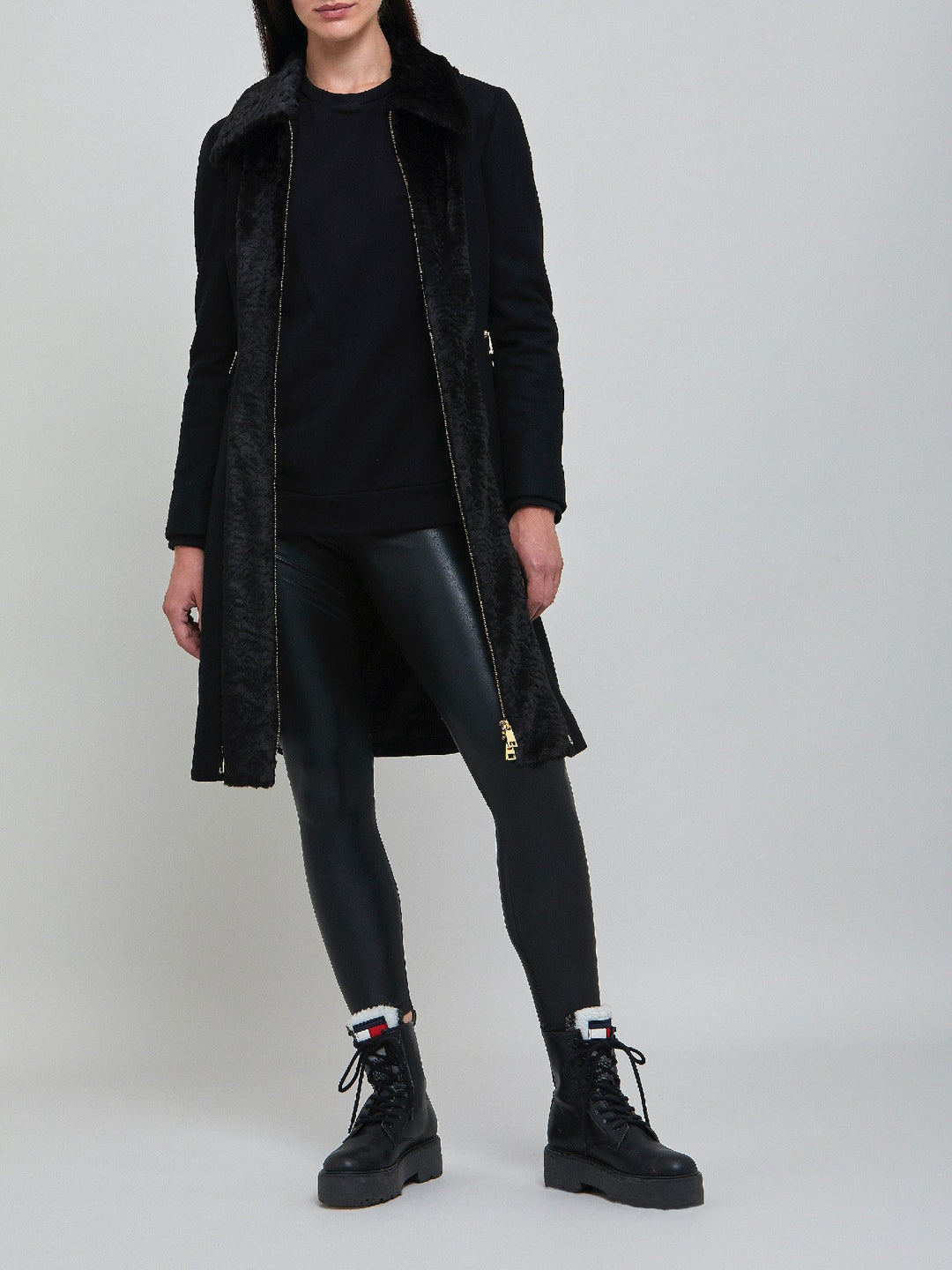 Elizabeth, true timeless sophistication in a black coat. An over-the-knee length coat made of cashmere blend, embellished with faux fur front panels and gold metal zippers, you will wear day after day.  Team with Belle or jill pant or for minimal style.