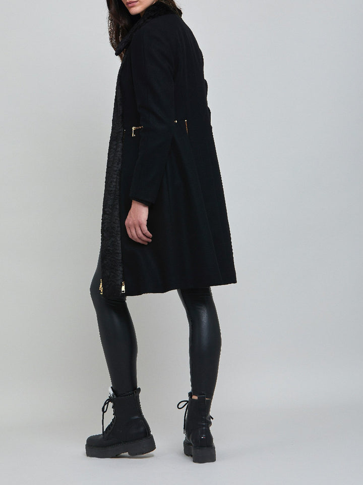 Elizabeth, true timeless sophistication in a black coat. An over-the-knee length coat made of cashmere blend, embellished with faux fur front panels and gold metal zippers, you will wear day after day.  Team with Belle or jill pant or for minimal style.