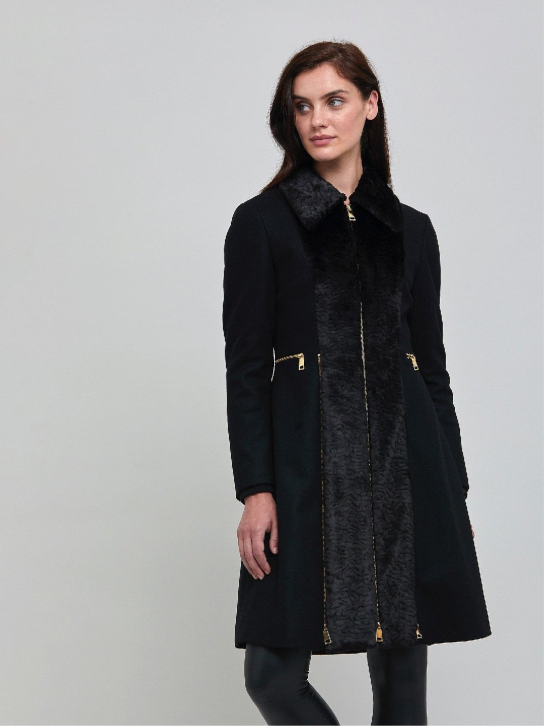 Elizabeth, true timeless sophistication in a black coat. An over-the-knee length coat made of cashmere blend, embellished with faux fur front panels and gold metal zippers, you will wear day after day.  Team with Belle or jill pant or for minimal style.