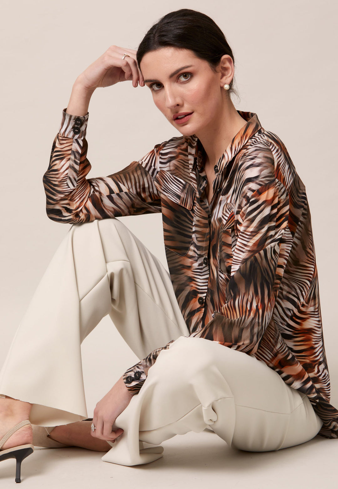 Elevate your day edit with the Ella utility shirt. It's engineered from a semi-sheer printed viscose crepe. This must-have shirt features patch pockets, back yoke & center back box pleat. An easy-fit shirt to elevate your everyday. Tuck into the Jill trousers then add heels and a blazer to create a refined daytime look that easily transitions into evening plans.