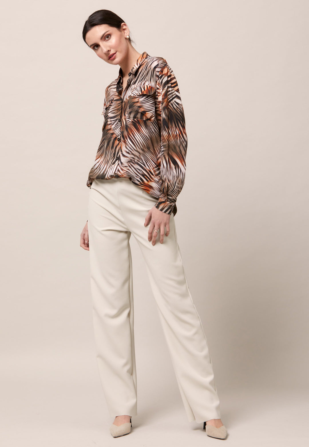 Elevate your day edit with the Ella utility shirt. It's engineered from a semi-sheer printed viscose crepe. This must-have shirt features patch pockets, back yoke & center back box pleat. An easy-fit shirt to elevate your everyday. Tuck into the Jill trousers then add heels and a blazer to create a refined daytime look that easily transitions into evening plans.