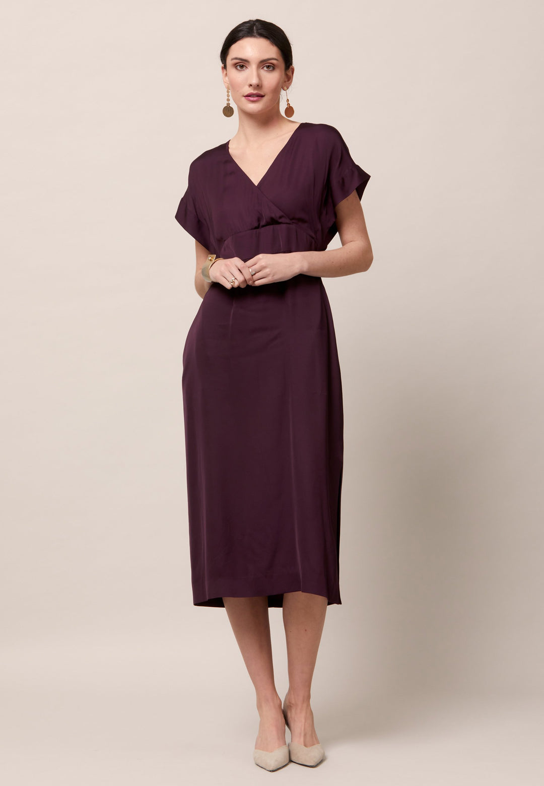 Evening edits get upgraded with the Fleur dress. Crafted in a luxurious Aubergine satin viscose. An easy-fitting silhouette with a v-neckline. Skirt falls to the mid-calf and side seam slit adds a sense of allure. Features handy Side seam pockets. Engineered with an elegant key-hole back neck detail. Simply add heels and a clutch for a look that turns heads at any event. Classic Occasionwear, modernized.