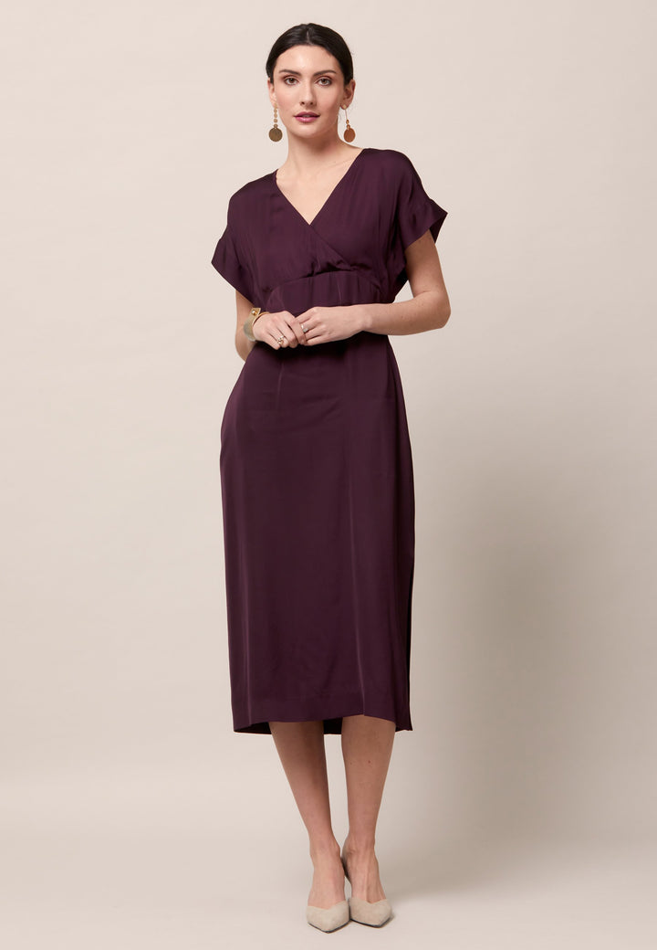 Evening edits get upgraded with the Fleur dress. Crafted in a luxurious Aubergine satin viscose. An easy-fitting silhouette with a v-neckline. Skirt falls to the mid-calf and side seam slit adds a sense of allure. Features handy Side seam pockets. Engineered with an elegant key-hole back neck detail. Simply add heels and a clutch for a look that turns heads at any event. Classic Occasionwear, modernized.