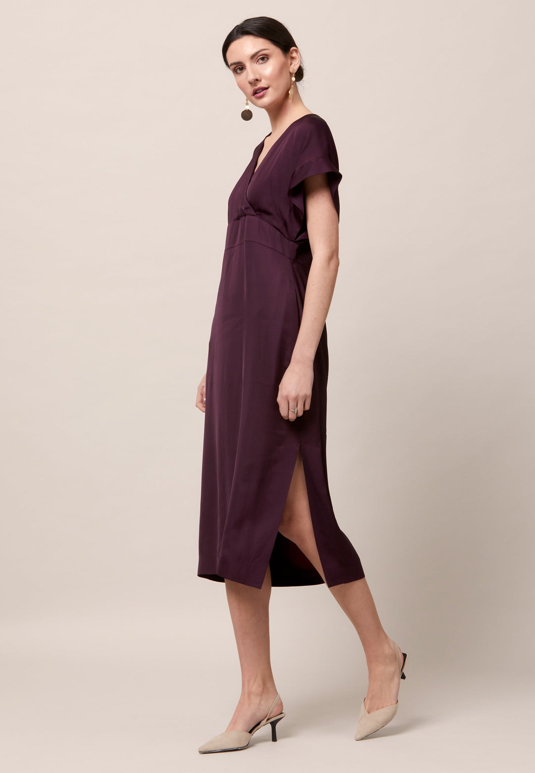 Evening edits get upgraded with the Fleur dress. Crafted in a luxurious Aubergine satin viscose. An easy-fitting silhouette with a v-neckline. Skirt falls to the mid-calf and side seam slit adds a sense of allure. Features handy Side seam pockets. Engineered with an elegant key-hole back neck detail. Simply add heels and a clutch for a look that turns heads at any event. Classic Occasionwear, modernized.