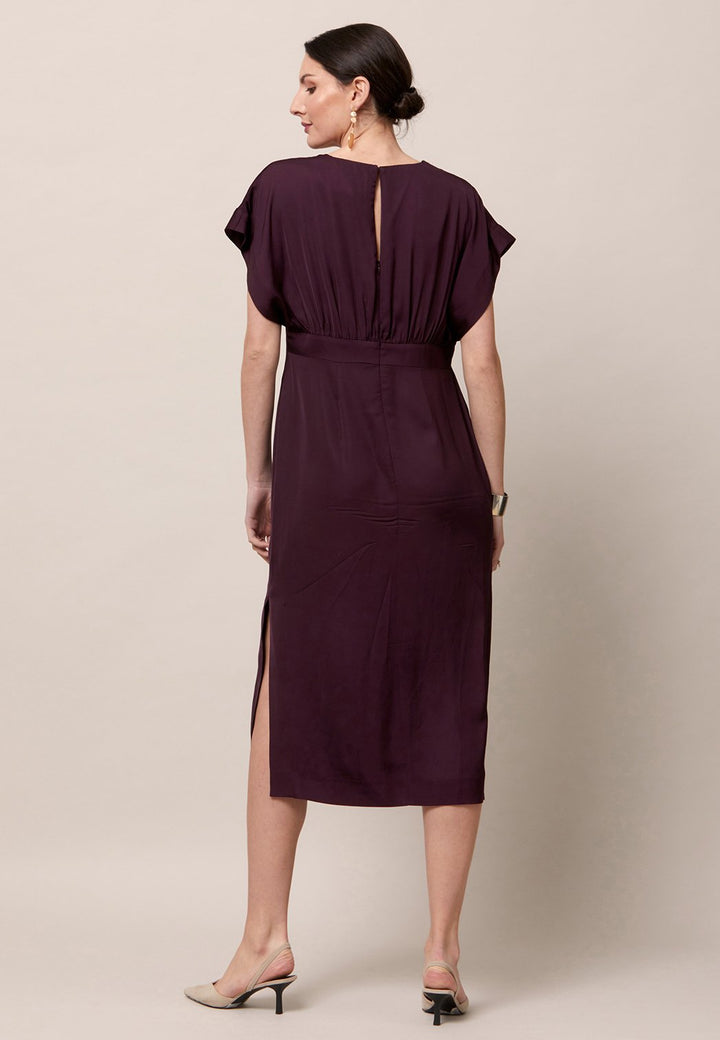 Evening edits get upgraded with the Fleur dress. Crafted in a luxurious Aubergine satin viscose. An easy-fitting silhouette with a v-neckline. Skirt falls to the mid-calf and side seam slit adds a sense of allure. Features handy Side seam pockets. Engineered with an elegant key-hole back neck detail. Simply add heels and a clutch for a look that turns heads at any event. Classic Occasionwear, modernized.