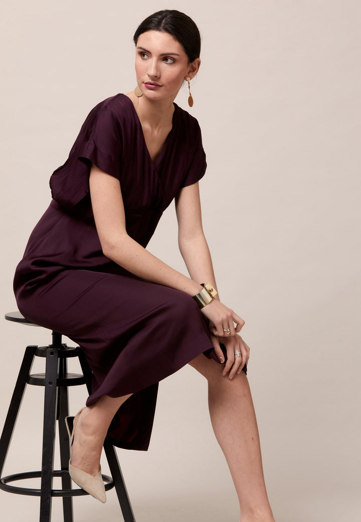 Evening edits get upgraded with the Fleur dress. Crafted in a luxurious Aubergine satin viscose. An easy-fitting silhouette with a v-neckline. Skirt falls to the mid-calf and side seam slit adds a sense of allure. Features handy Side seam pockets. Engineered with an elegant key-hole back neck detail. Simply add heels and a clutch for a look that turns heads at any event. Classic Occasionwear, modernized.