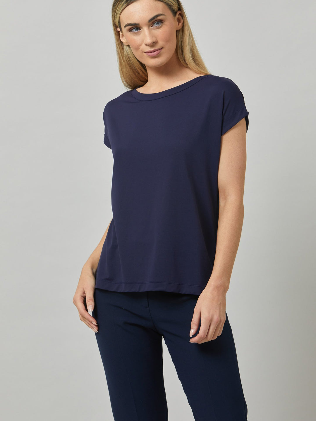 Gina, a fluid T-shirt with a clean crew neck, made to be worn oversized for slouchy ease. Fabricated in fine knit, this style features our elevated neutrals collection. Styled with the elegant Jill Pant.