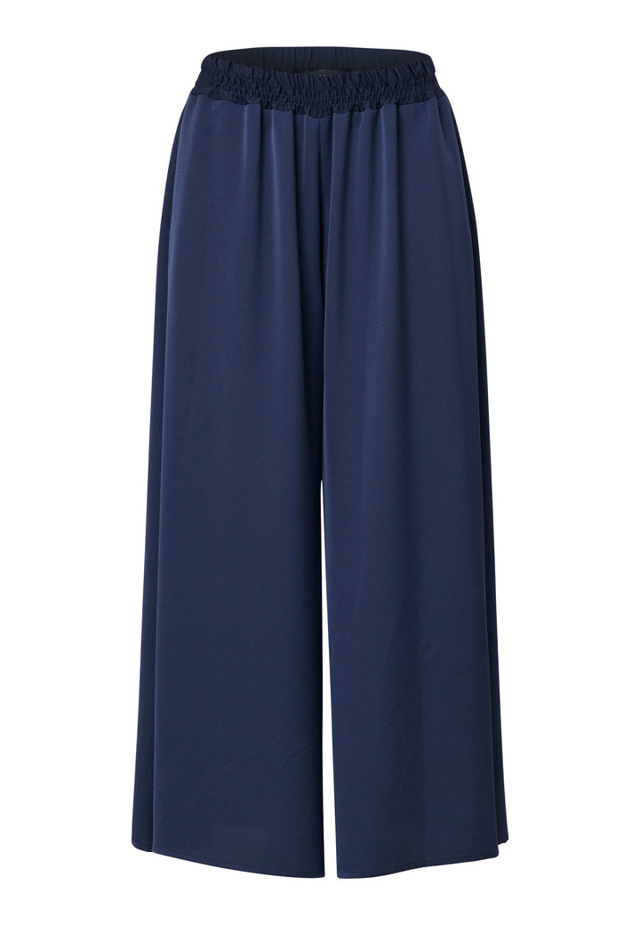 Imogen Midnight Navy Trousers, a chic and versatile addition to your wardrobe. Crafted with a wide leg and made from machine washable satin-back crepe fabric, these trousers offer comfort with an elasticated gathered waistband.