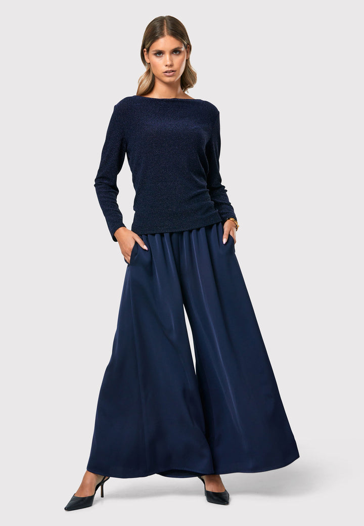 Imogen Midnight Navy Trousers, a chic and versatile addition to your wardrobe. Crafted with a wide leg and made from machine washable satin-back crepe fabric, these trousers offer comfort with an elasticated gathered waistband.