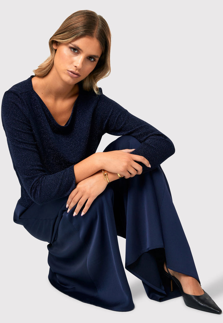 Imogen Midnight Navy Trousers, a chic and versatile addition to your wardrobe. Crafted with a wide leg and made from machine washable satin-back crepe fabric, these trousers offer comfort with an elasticated gathered waistband.