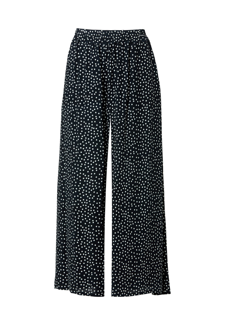 The Imogen Navy and White Polka Dot Trousers bring chic versatility to your wardrobe. With a drapey wide leg and crafted from our beloved sustainable viscose crepe, these trousers prioritize comfort with an elasticated gathered waistband. The timeless navy adorned with white polka dots adds a classic touch, elegantly falling to the ankle.