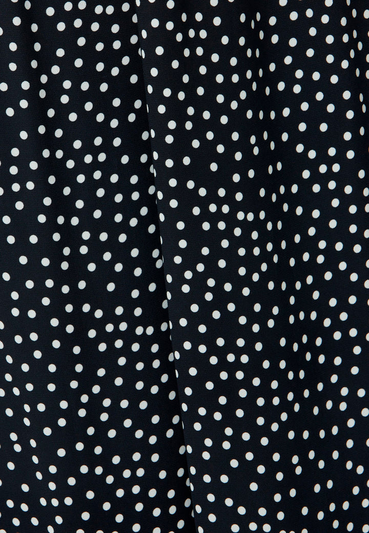 The Imogen Navy and White Polka Dot Trousers bring chic versatility to your wardrobe. With a drapey wide leg and crafted from our beloved sustainable viscose crepe, these trousers prioritize comfort with an elasticated gathered waistband. The timeless navy adorned with white polka dots adds a classic touch, elegantly falling to the ankle.
