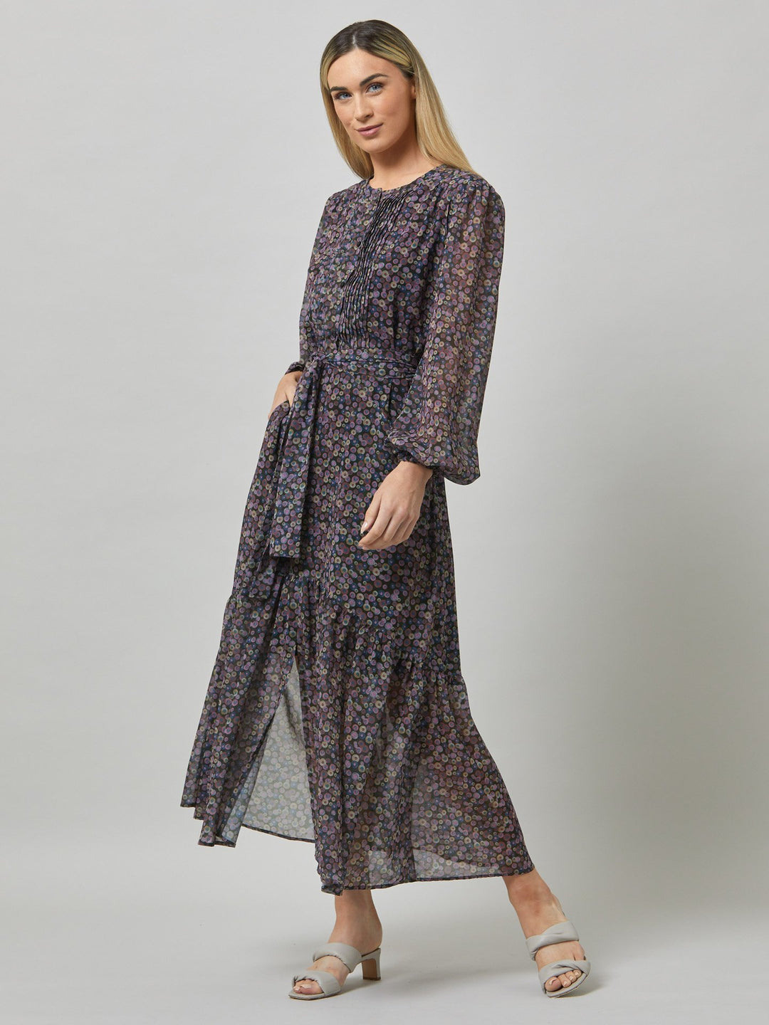 Opt for izzy, the ultimate take-you-anywhere dress. Crafted in breathable viscose georgette in a random multi-coloured dot print. Cut to a fluid silhouette for a timeless mood with a modern look. Note the delicate pin tucked detailed bodice, grandfather collar and flattering flowing skirt. 