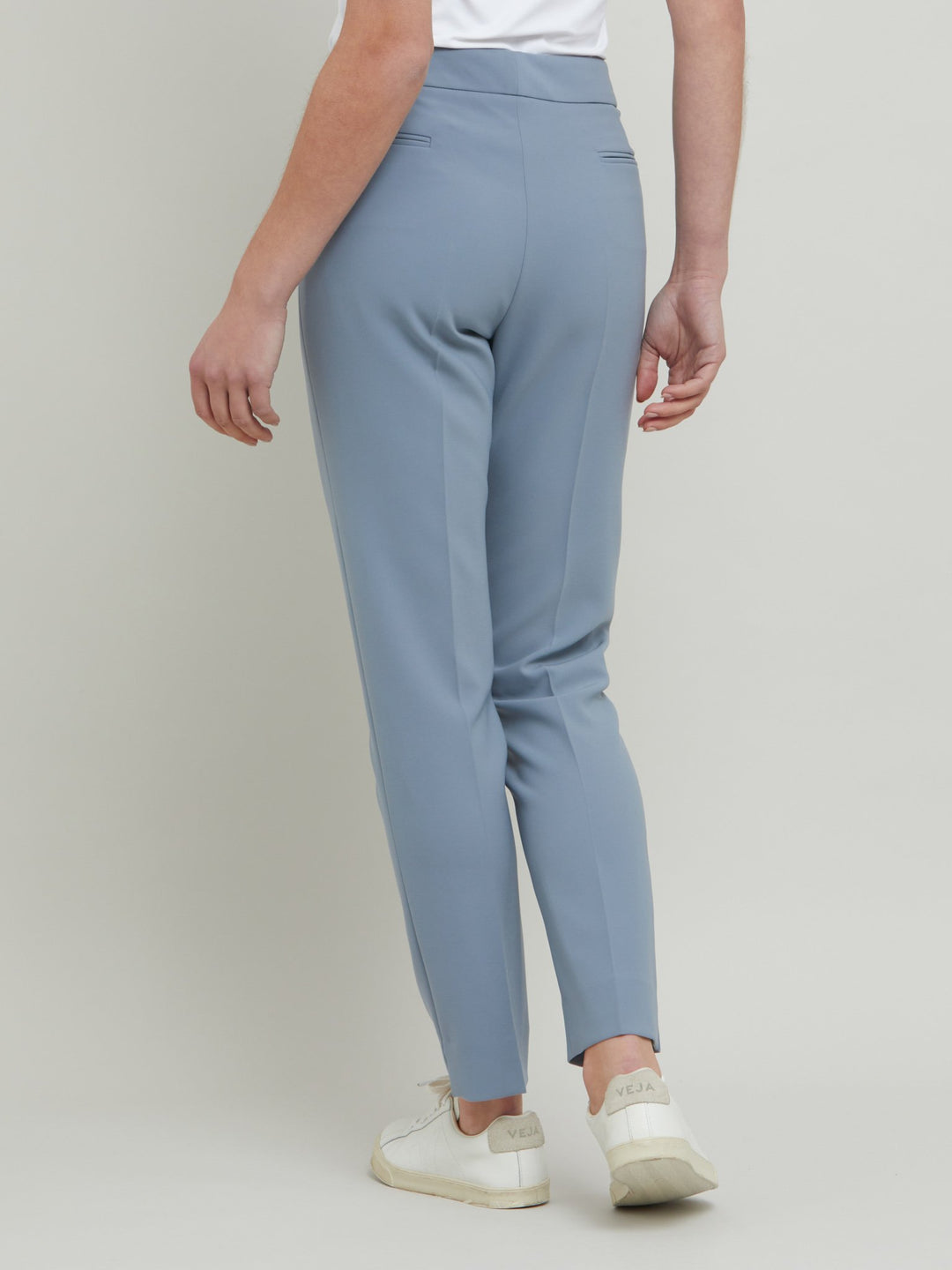 Jill, an investment worthy, neat narrow-leg trouser crafted in our signature double crepe with a hint of stretch. A wardrobe staple & HMcA classic. This season in a sophisticated smoky blue. Designed in Ireland by Helen McAlinden. Made in Europe. Free shipping to the EU & UK.