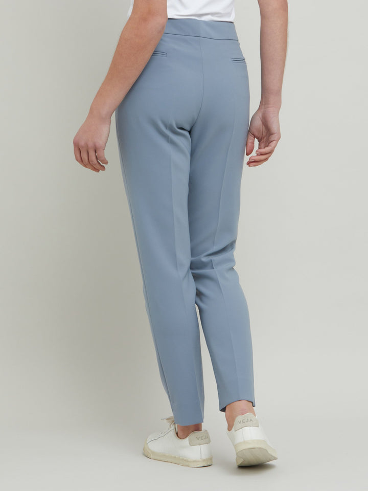 Jill, an investment worthy, neat narrow-leg trouser crafted in our signature double crepe with a hint of stretch. A wardrobe staple & HMcA classic. This season in a sophisticated smoky blue. Designed in Ireland by Helen McAlinden. Made in Europe. Free shipping to the EU & UK.