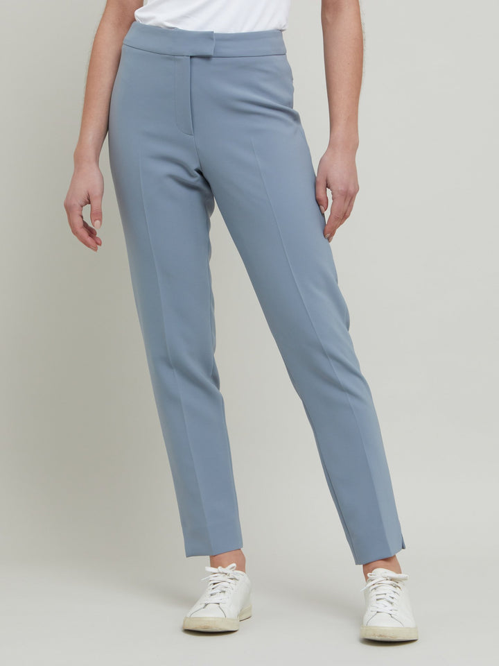 Jill, an investment worthy, neat narrow-leg trouser crafted in our signature double crepe with a hint of stretch. A wardrobe staple & HMcA classic. This season in a sophisticated smoky blue. Designed in Ireland by Helen McAlinden. Made in Europe. Free shipping to the EU & UK.
