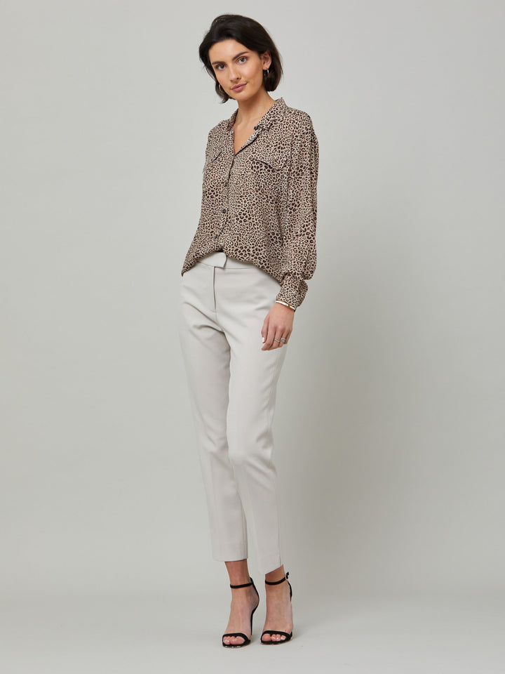 full body picture of model wearing latte jill. Investment-worthy, neat narrow-leg trouser with a hint of stretch. A wardrobe staple and HMcA classic, here in a sophisticated latte shade