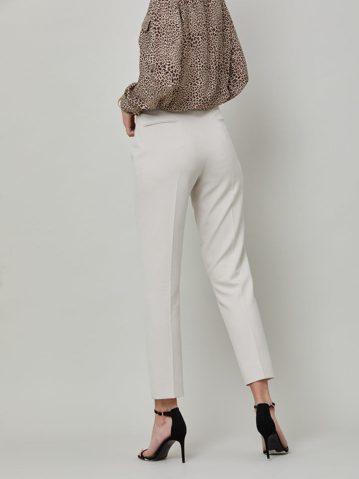 back picture of model wearing latte jill. Investment-worthy, neat narrow-leg trouser with a hint of stretch. A wardrobe staple and HMcA classic, here in a sophisticated latte shade