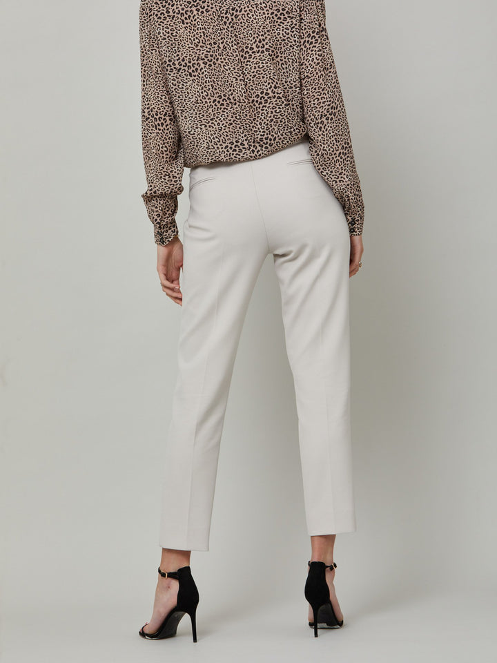 back picture of model wearing latte jill. Investment-worthy, neat narrow-leg trouser with a hint of stretch. A wardrobe staple and HMcA classic, here in a sophisticated latte shade