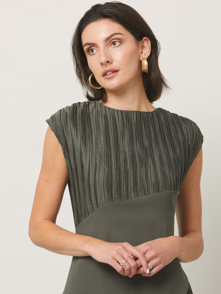 Opt for june, elegant dressing redefined. A simple slip on dress in an olive polished pleated fabric. Cut to a fluid easy fitting silhouette for a timeless mood with a modern look.