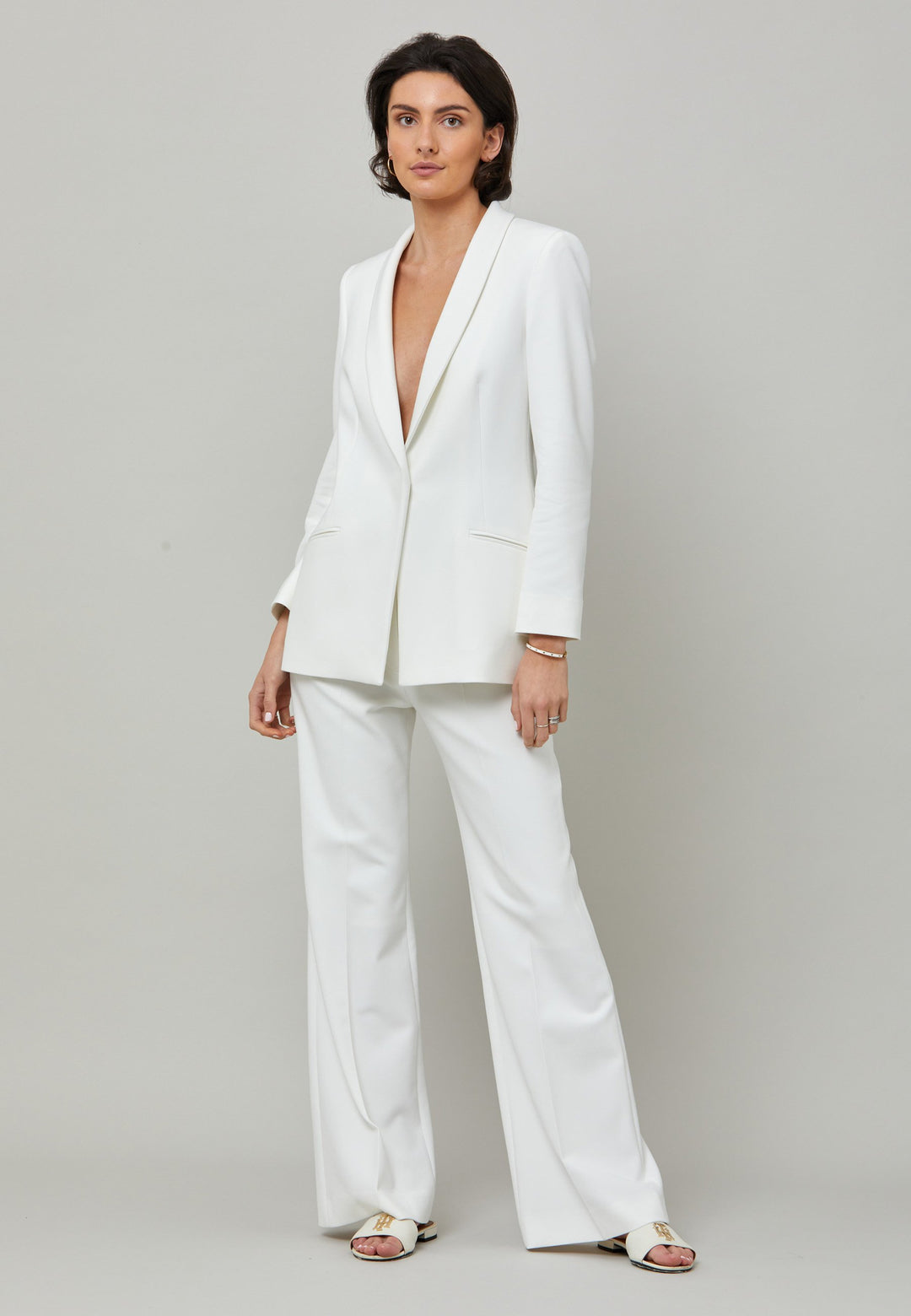 Kelly, an iconic white flare pant. Crafted in sustainable double crepe with a hint of stretch. Revisit the 70's for this season’s game-changing look. Flares are sophisticated, comfortable & leg-lengthening. Guaranteed to flatter the form & never far from fashion’s front line