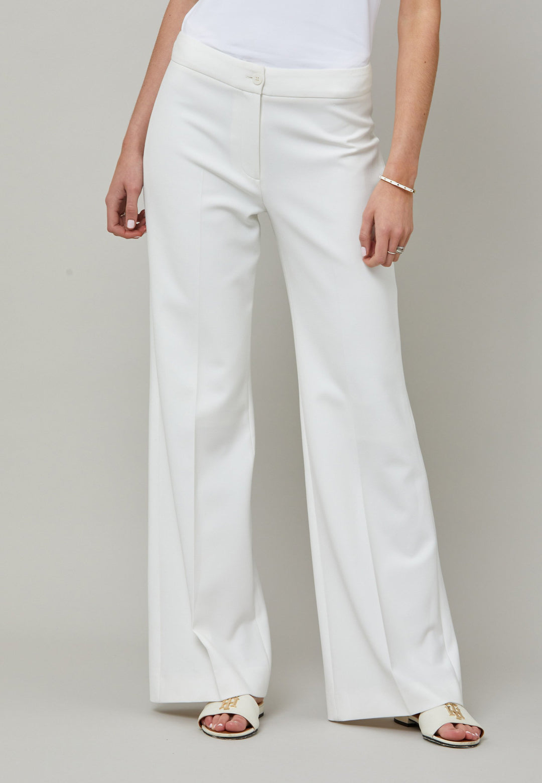 Kelly, an iconic white flare pant. Crafted in sustainable double crepe with a hint of stretch. Revisit the 70's for this season’s game-changing look. Flares are sophisticated, comfortable & leg-lengthening. Guaranteed to flatter the form & never far from fashion’s front line