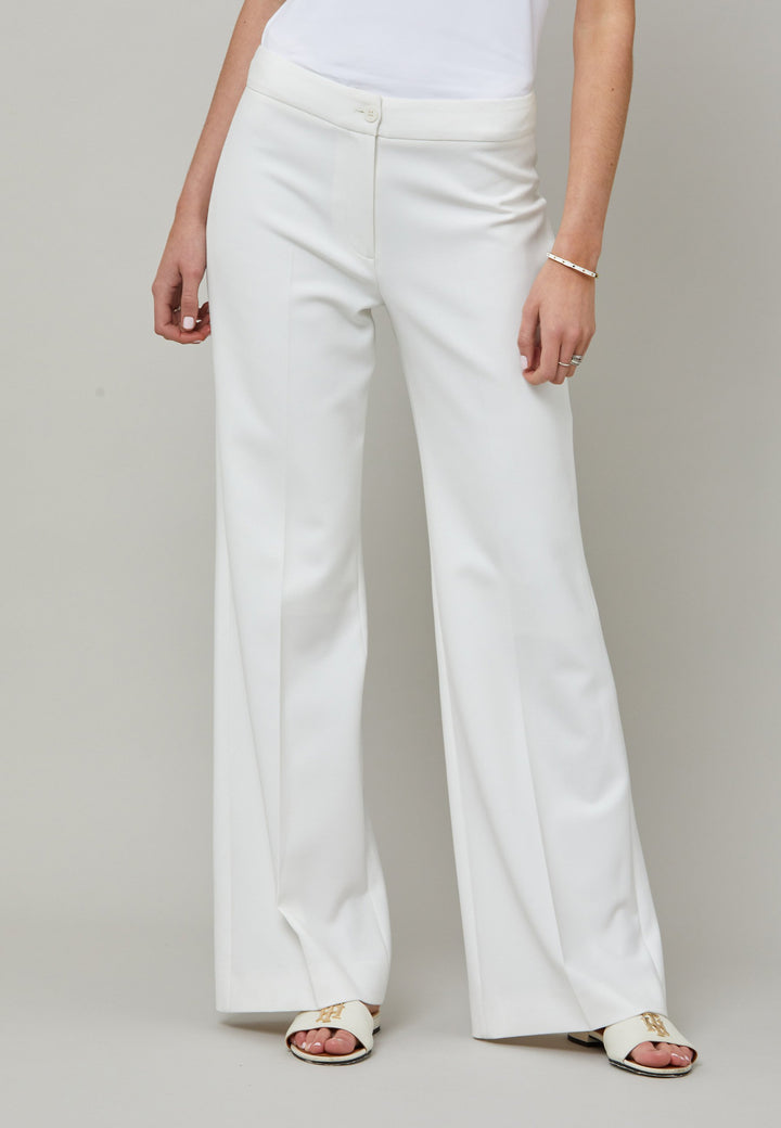 Kelly, an iconic white flare pant. Crafted in sustainable double crepe with a hint of stretch. Revisit the 70's for this season’s game-changing look. Flares are sophisticated, comfortable & leg-lengthening. Guaranteed to flatter the form & never far from fashion’s front line