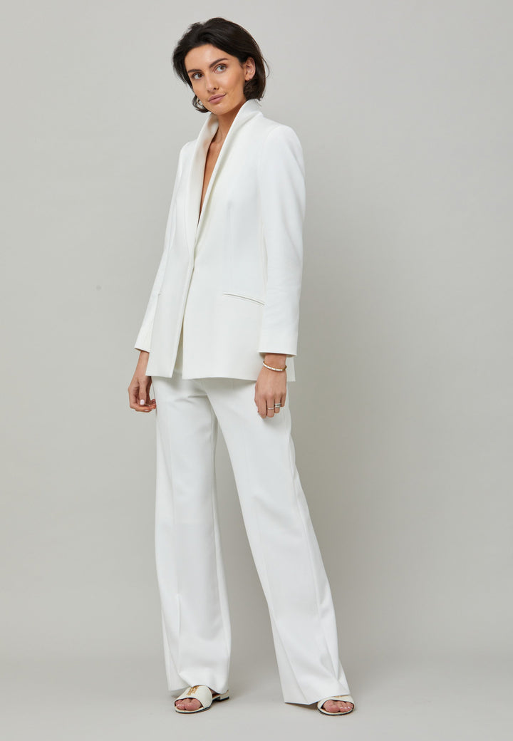 Kelly, an iconic white flare pant. Crafted in sustainable double crepe with a hint of stretch. Revisit the 70's for this season’s game-changing look. Flares are sophisticated, comfortable & leg-lengthening. Guaranteed to flatter the form & never far from fashion’s front line