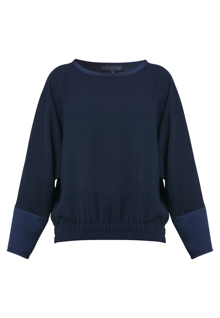 al Midnight Navy Top, a stylish and versatile addition to your wardrobe. Crafted from satin back crepe, it offers a luxurious feel and drapes beautifully. The dropped shoulder design, eleasticated hem and full-length sleeves 