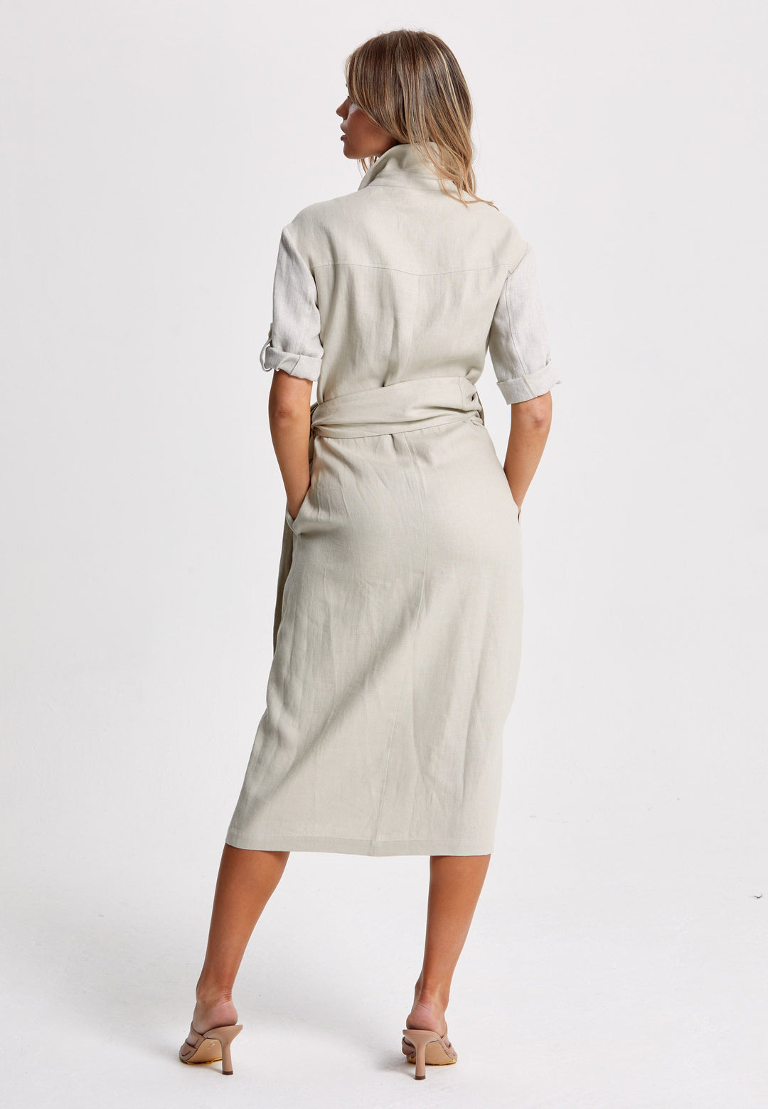 Leonne, the investment-worthy oatmeal linen wrap dress. Crafted in a sustainable Irish linen. An aunthetic wrap dress that ties to the side with a generous belt and flattering gathers at the waist. Engineered with a turned back elbow length sleeve. The ultimate summer staple.