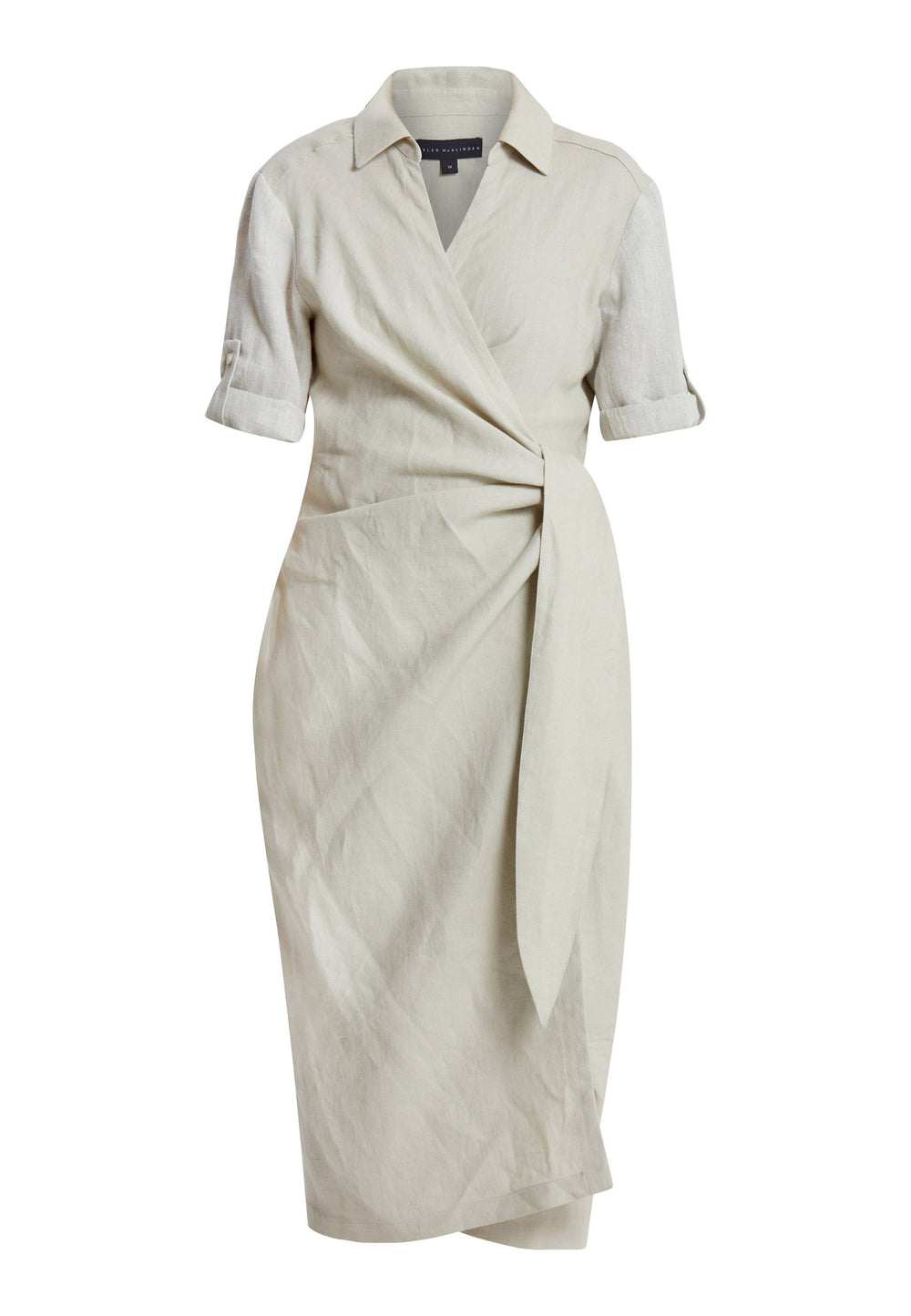 Leonne, the investment-worthy oatmeal linen wrap dress. Crafted in a sustainable Irish linen. An aunthetic wrap dress that ties to the side with a generous belt and flattering gathers at the waist. Engineered with a turned back elbow length sleeve. The ultimate summer staple.