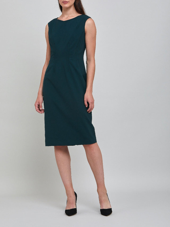 Livia, an elegant sleeveless dress, fabricated in woolen crepe. An expertly tailored form-flattering silhouette that falls right over the knee, with a hint of elastane to ensure comfort & ease of movement. 