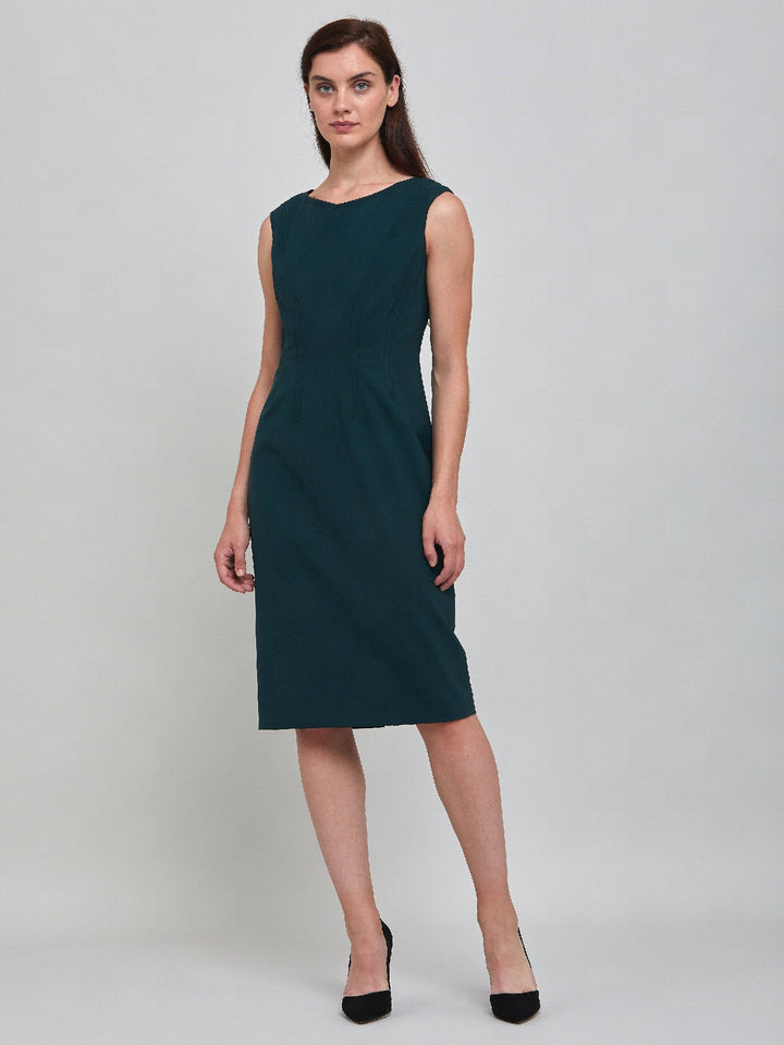 Livia, an elegant sleeveless dress, fabricated in woolen crepe. An expertly tailored form-flattering silhouette that falls right over the knee, with a hint of elastane to ensure comfort & ease of movement. 