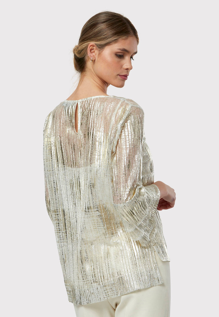 Elevate your evening look with the Lola Golden Blouse. Exuding effortless elegance, this piece boasts an easy fit complemented by a jewel neckline and triple-frilled sleeves. Crafted from luxurious metallic fabric with a semi-transparent allure, it comes complete with a detachable slip, encapsulating the essence of chic sophistication.