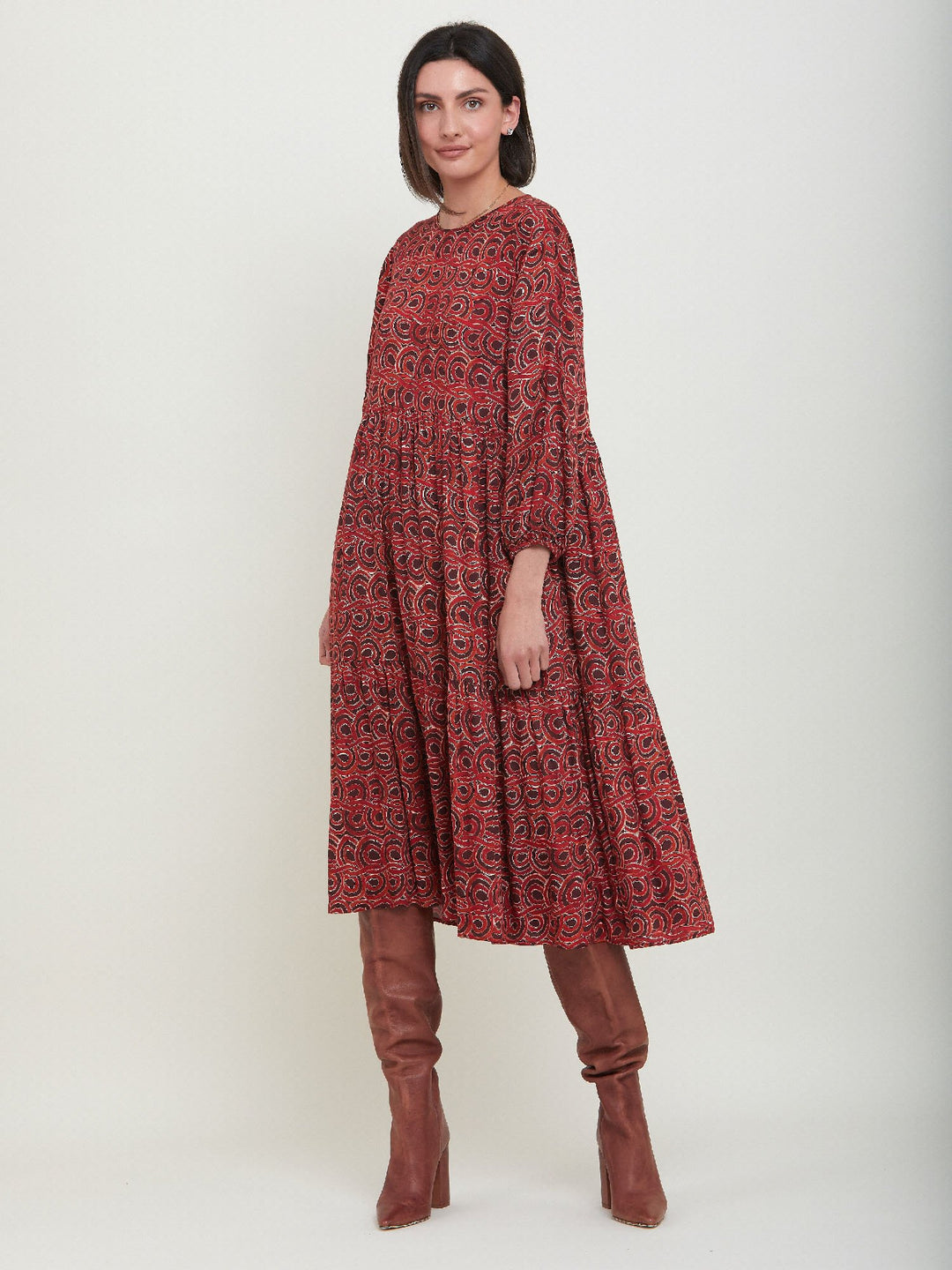 Louis, an easy smock dress. Crafted in a fluid, red & russet tone, abstract print viscose. An empire line dress with handy pockets & a softly gathered two-tier skirt that falls to the mid-calf. Offers a delicate keyhole back neck & a matching belt. Style with a tan boot for a 70's vibe.