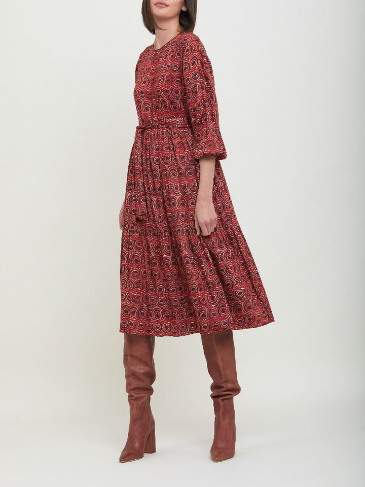 Louis, an easy smock dress. Crafted in a fluid, red & russet tone, abstract print viscose. An empire line dress with handy pockets & a softly gathered two-tier skirt that falls to the mid-calf. Offers a delicate keyhole back neck & a matching belt. Style with a tan boot for a 70's vibe.