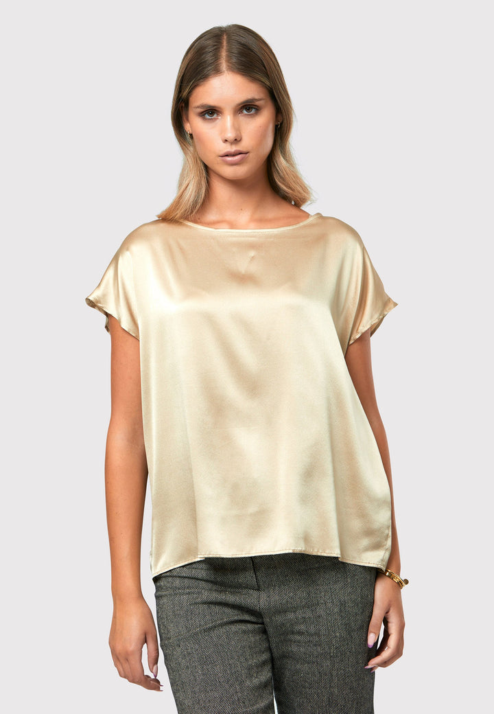 Lucy gold shell top, a luxurious and versatile addition to your wardrobe. Crafted from a lux silk blend, this exquisite top offers a sumptuous feel against your skin.