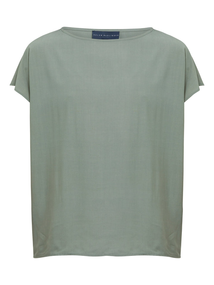 Lucy, our classic shell top redefined in a soft lichen green viscose crepe. A simple wardrobe essential.