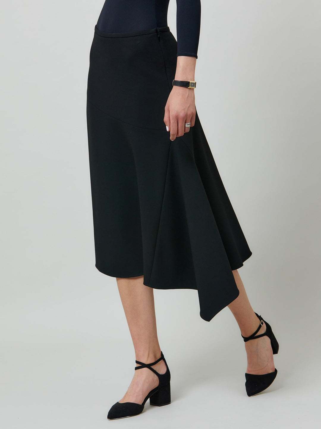 Maddison, an everyday hero! This flattering piece falls below the kn ee with an asymmetric hem. Sophisticated city style in fail-safe black. for a chic everyday look style with your favourite black boots or dress up at night with heels.