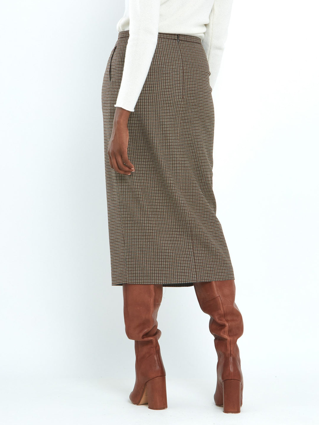 A faux wrap, mid calf length pencil skirt in a soft handle micro check. Sophisticated city style with a hint of heritage. 