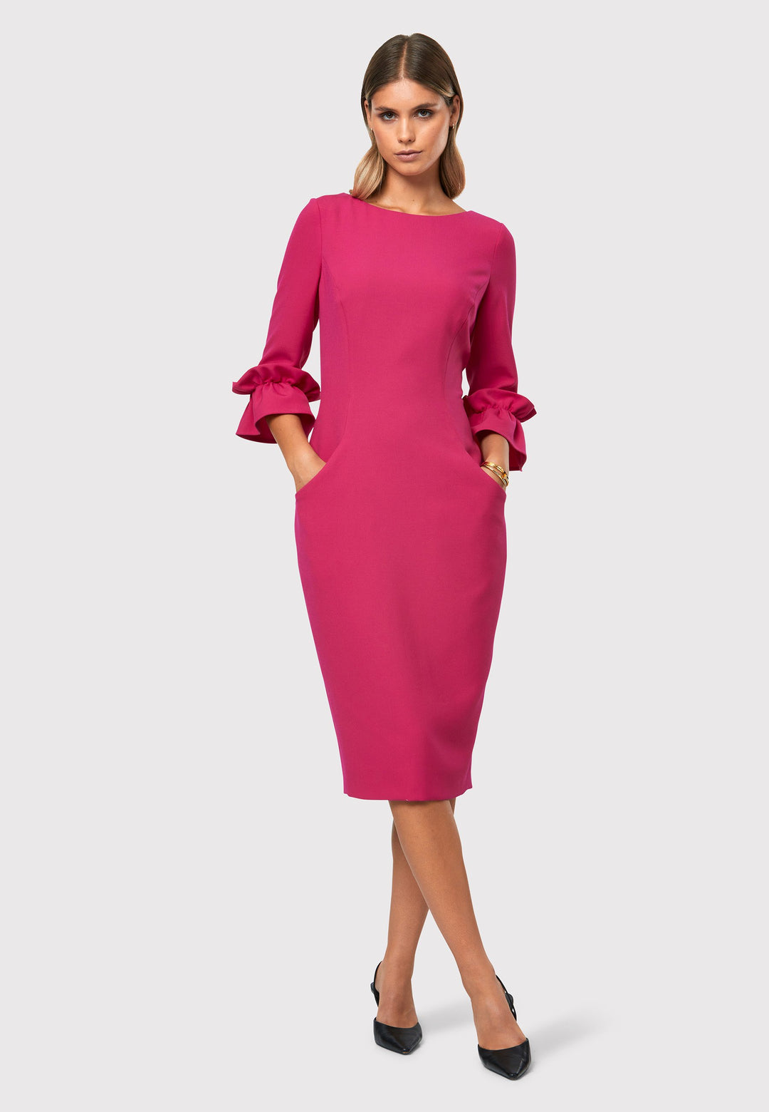Unveiling the Maisie Cerise Pink Dress, a charming and stylish piece that exudes feminine allure. With its flattering body-skimming silhouette and elegant slash neckline, this dress is perfect for special events or making a statement. Falling to a chic mid-calf length with a back vent providing ease of movement. The fabric incorporates a hint of stretch, ensuring a comfortable and flattering fit. The playful puff frill sleeves add a touch of romance, making it a versatile and captivating choice.