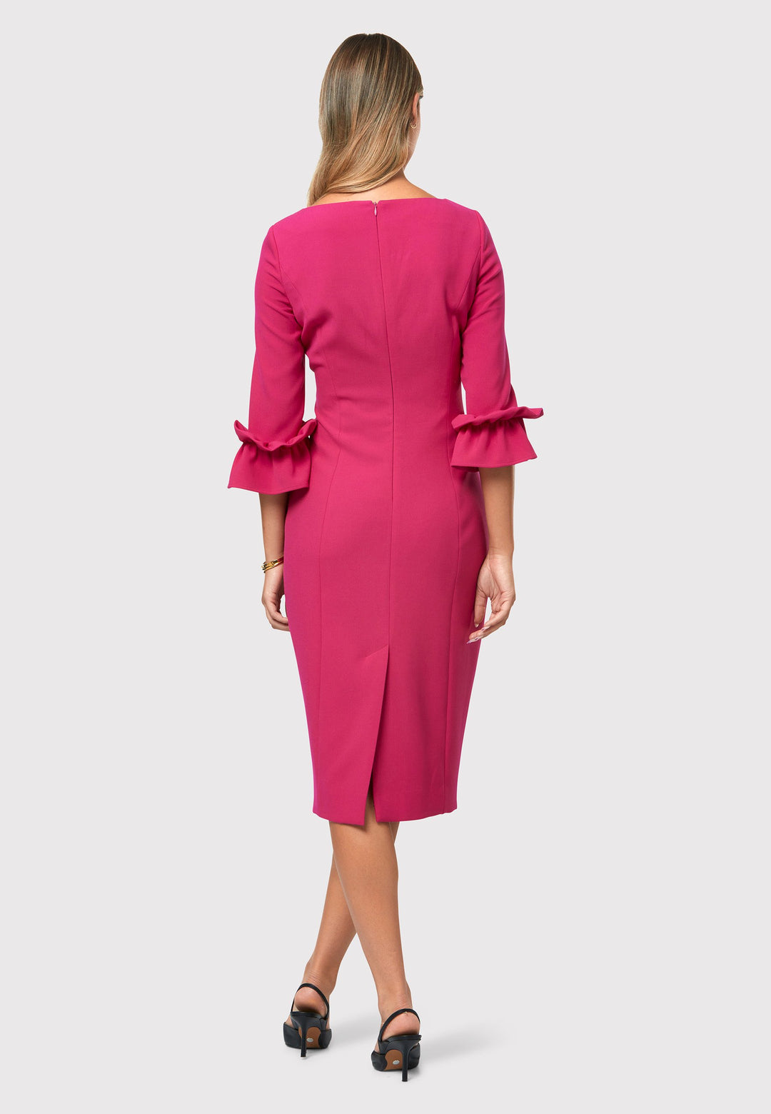 Unveiling the Maisie Cerise Pink Dress, a charming and stylish piece that exudes feminine allure. With its flattering body-skimming silhouette and elegant slash neckline, this dress is perfect for special events or making a statement. Falling to a chic mid-calf length with a back vent providing ease of movement. The fabric incorporates a hint of stretch, ensuring a comfortable and flattering fit. The playful puff frill sleeves add a touch of romance, making it a versatile and captivating choice.