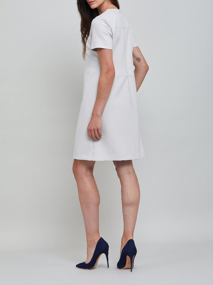 Marina, an elegant A-line dress, fabricated in ligth silver double crepe. An expertly tailored form flattering silhouette that falls right over-the-knee, with a hint of elastane to ensure comfort & ease of movement. 