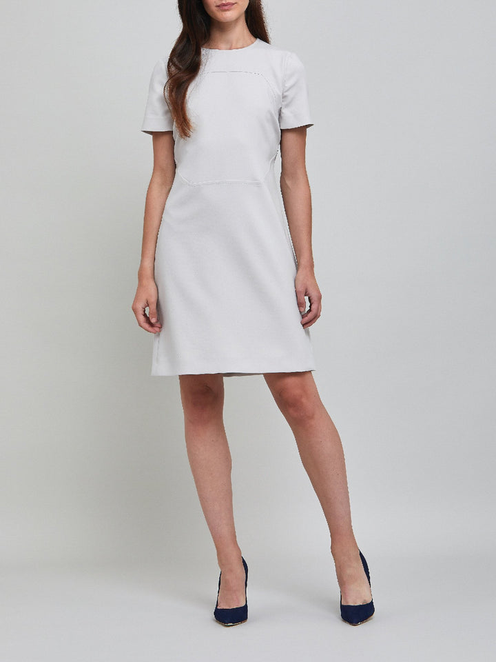 Marina, an elegant A-line dress, fabricated in ligth silver double crepe. An expertly tailored form flattering silhouette that falls right over-the-knee, with a hint of elastane to ensure comfort & ease of movement. 