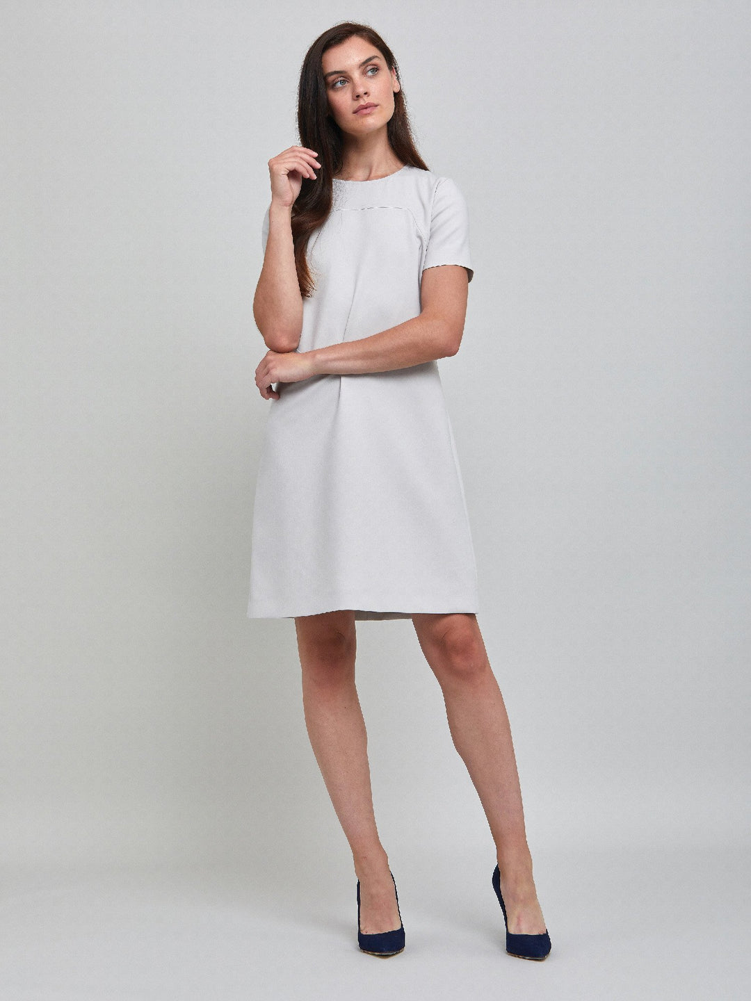 Marina, an elegant A-line dress, fabricated in ligth silver double crepe. An expertly tailored form flattering silhouette that falls right over-the-knee, with a hint of elastane to ensure comfort & ease of movement. 
